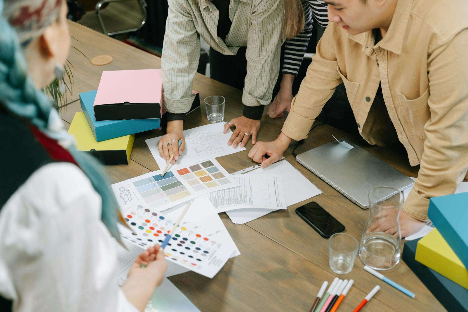 a group of people having a meeting in the office